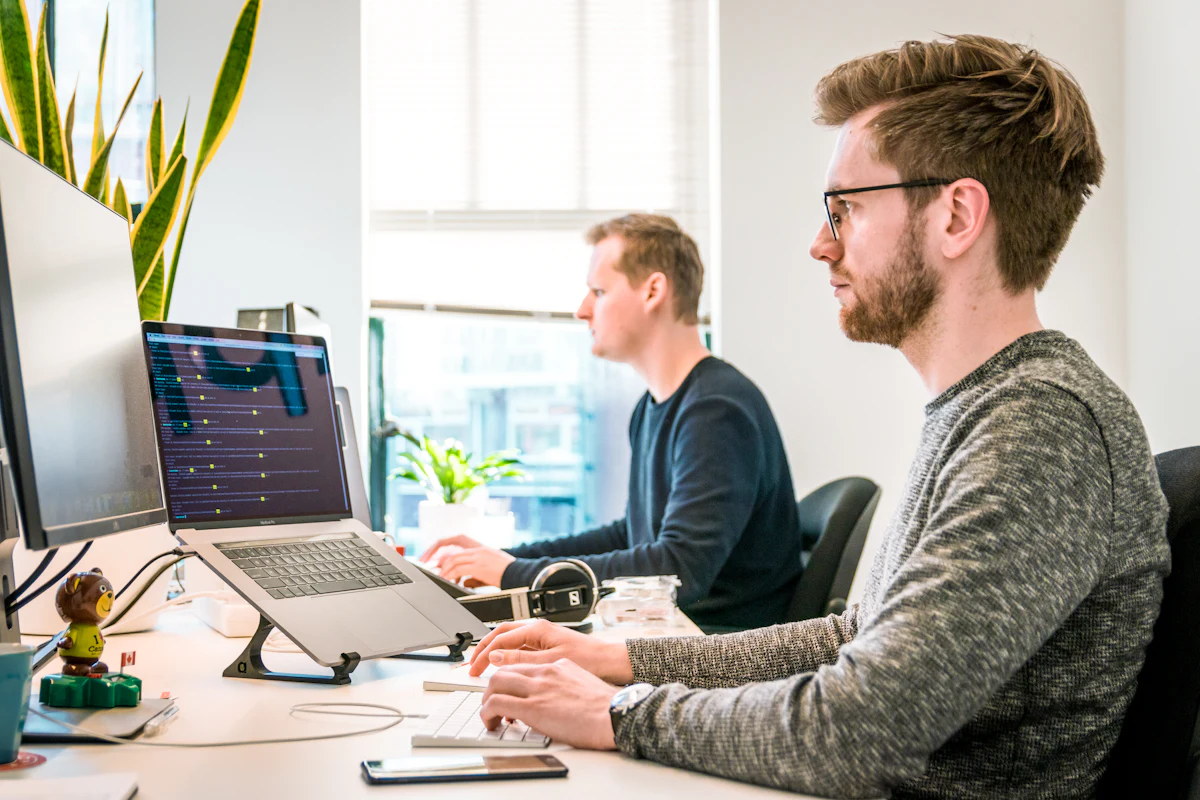 A developer reading code on a screen, representing a testing strategy